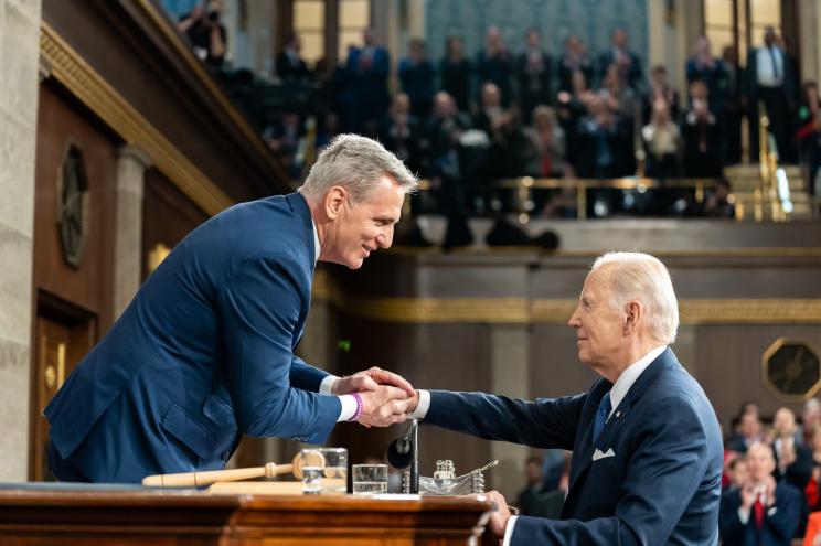 President Joe Biden greets House Speaker Kevin McCarthy .