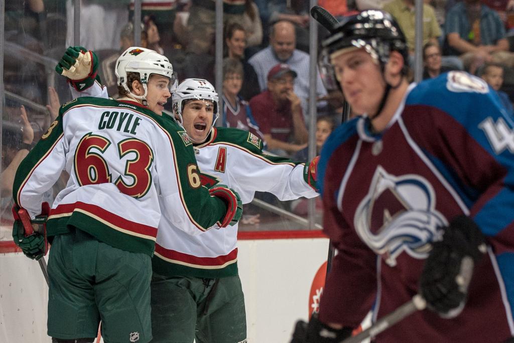 Zach Parise and Charlie Coyle celebrate a Minnesota Wild goal in the final game of the 2012-13 season.