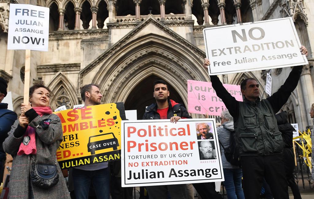 Julian Assange supporters gather outside the High Court in London, Britain in 2021.