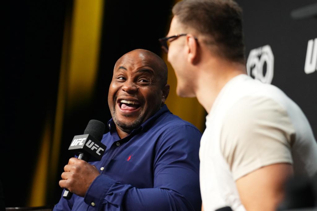 UFC commentator Daniel Cormier laughs the UFC 30th anniversary