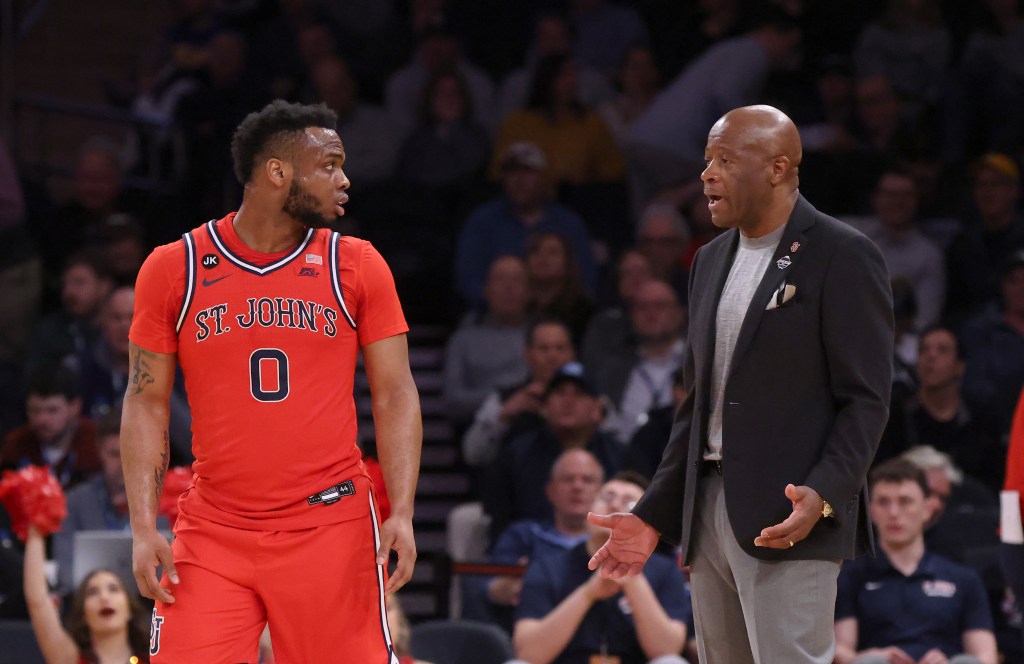 Mike Anderson (r.) and St. John's guard Posh Alexander during a Big East Tournament game against Marquette on March 9, 2023.