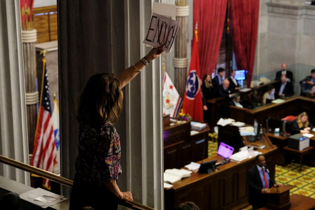 A mother holds a sign inside the Tennessee State Capitol to call for an end to gun violence and support stronger gun laws after a deadly shooting at the Covenant School in Nashville, Tennessee, U.S., April 3, 2023.