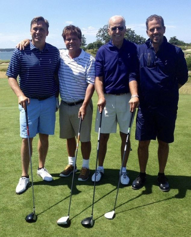 Archer posing with Joe and Hunter Biden in 2014.