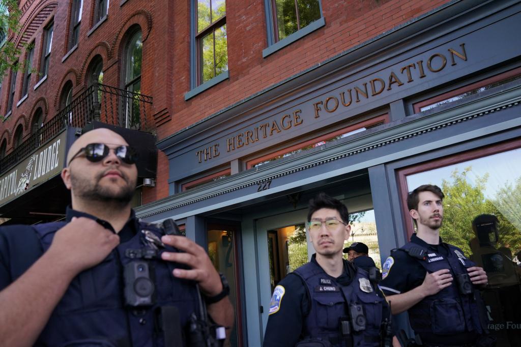 Law enforcement gathers outside of the Heritage Foundation.