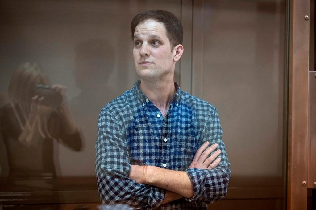 Wall Street Journal reporter Evan Gershkovich stands in a glass cage in a courtroom at the Moscow City Court, in Moscow, Russia, Tuesday, April 18, 2023.