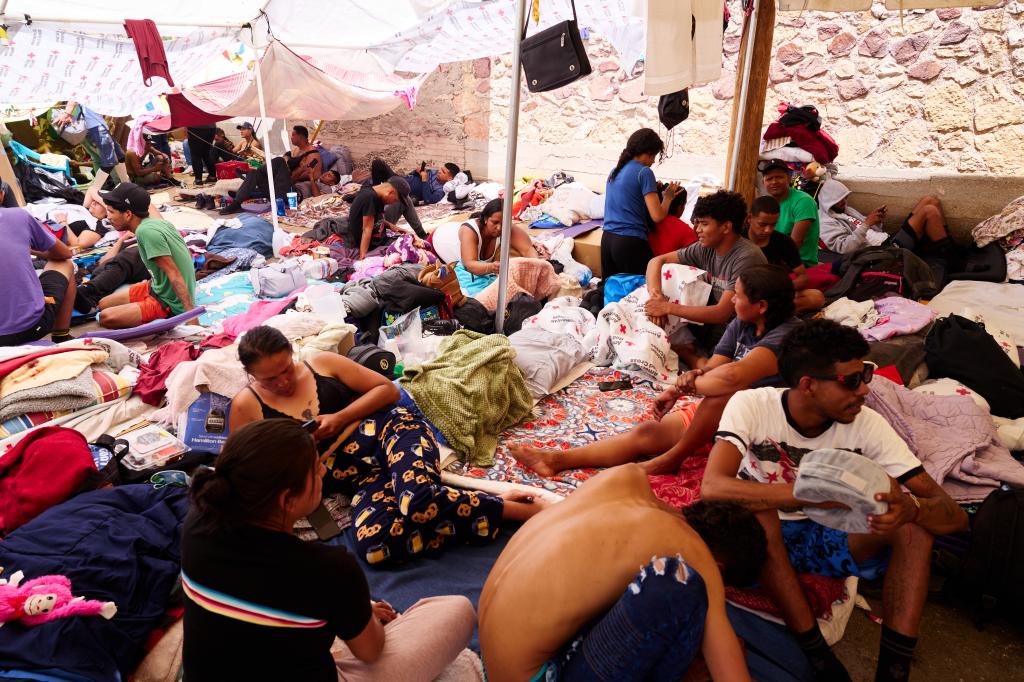 Migrants in a tent outside of the Opportunity Center for the Homeless in El Paso on May 2, 2023.