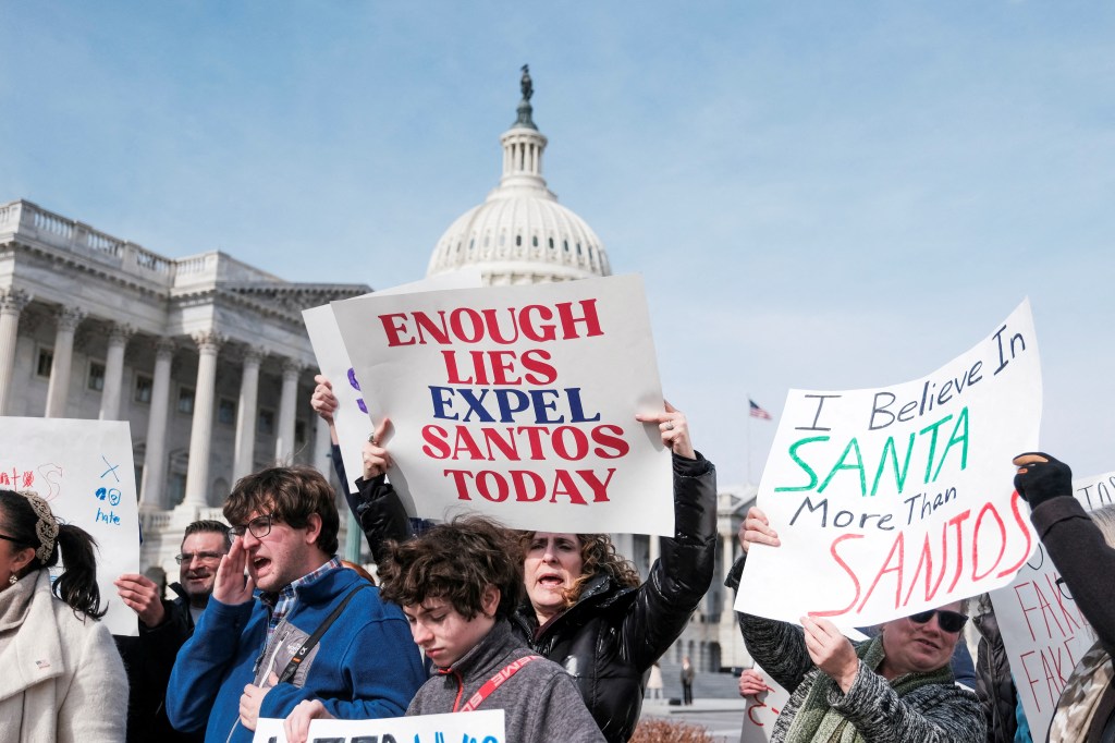 Protestors held banners and called for the resignation of Representative George Santos at the U.S., Capitol.