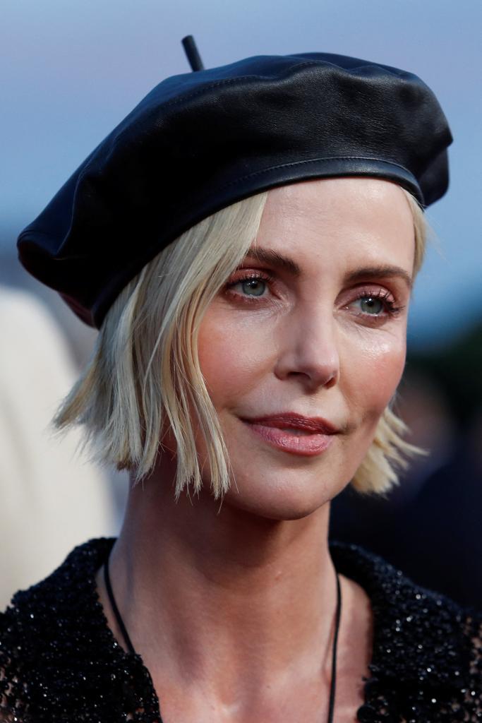 Kelly said that Theron, the Oscar-winning actress, was "privileged."