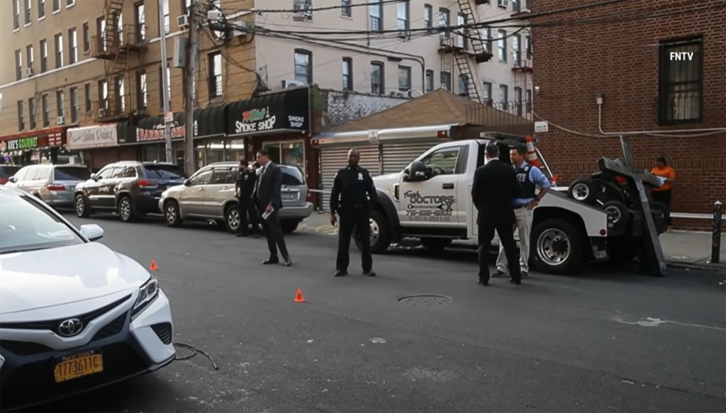 Police investigate the scene where Jerome Burleigh, 18, was shot and killed at E 172nd St and Commonwealth Ave.