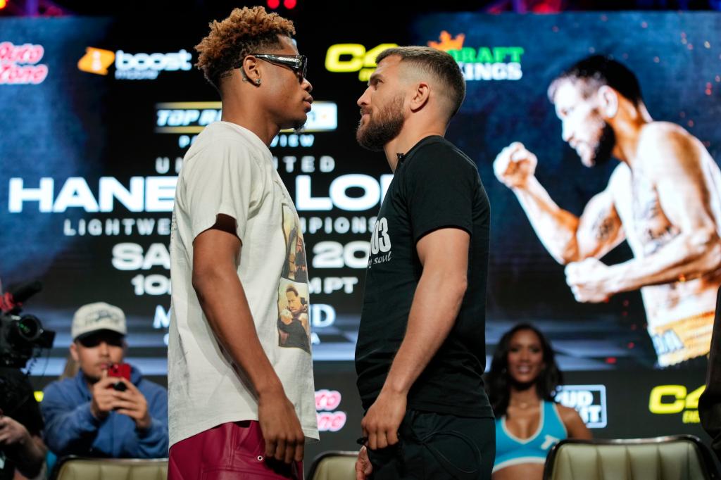 Vasiliy Lomachenko (r.) and Devan Haney square off ahead of their undisputed title fight.