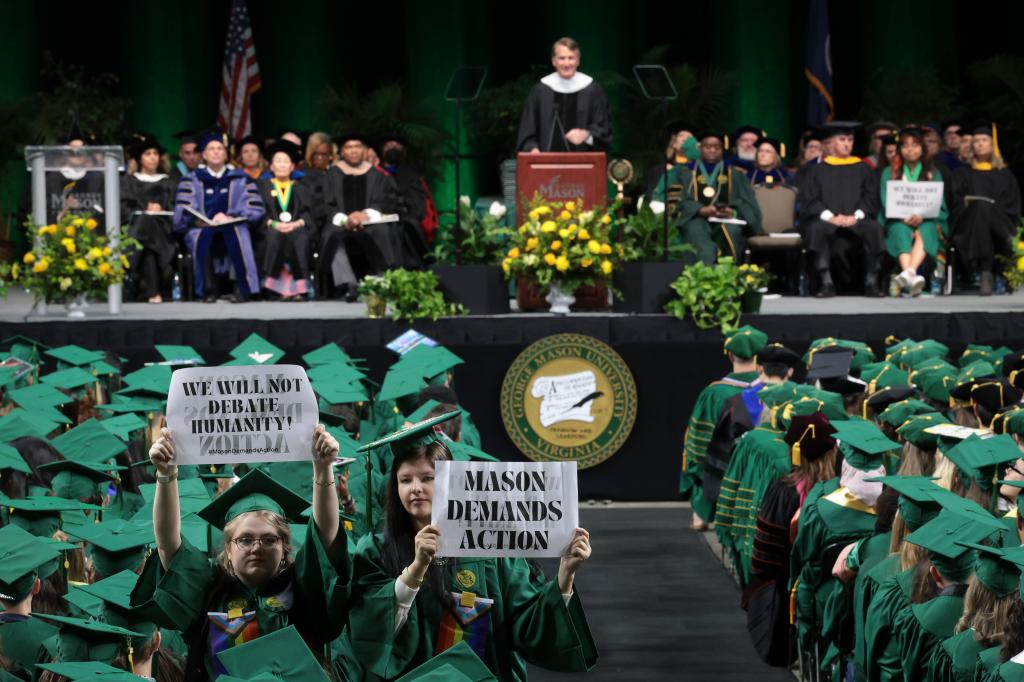 Some students heckled and jeered the governor and walked out of the ceremony.