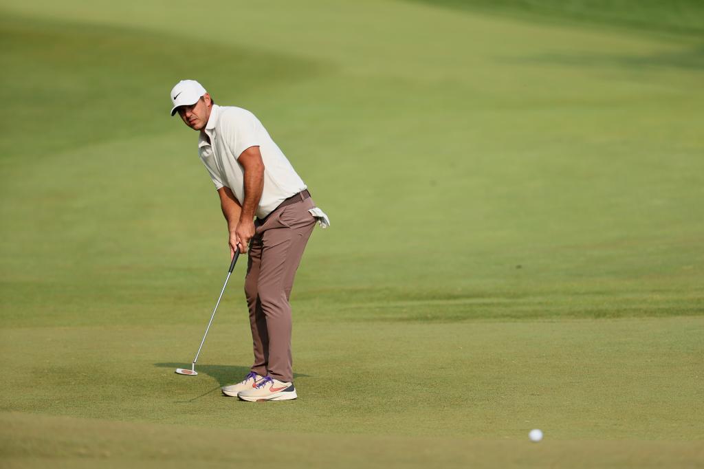 Brooks Koepka putts on the 13th green during the final round of the PGA Championship.