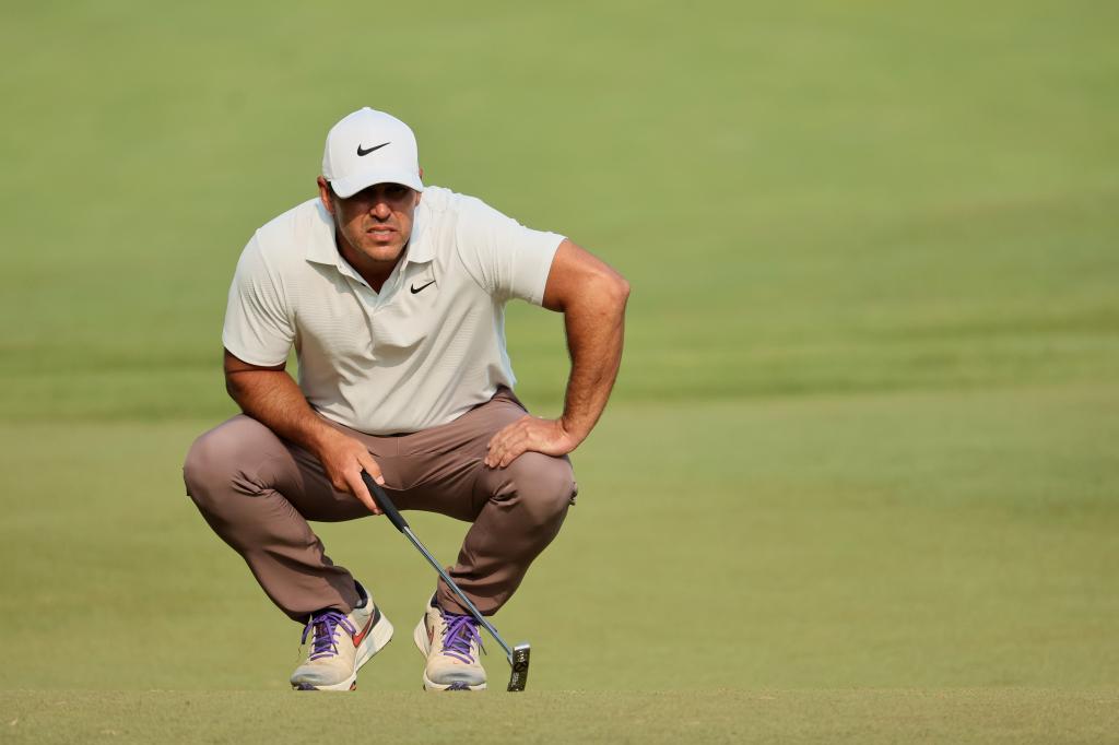 Brooks Koepka lines up a putt during the final round of the PGA Championship on May 21.