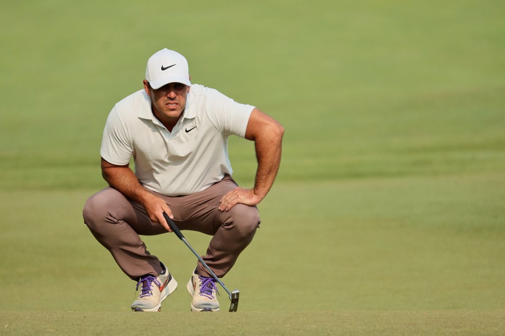 Brooks Koepka lines up a putt during the final round of the PGA Championship on May 21.