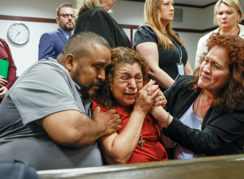 Relatives of the slain victims react in court.