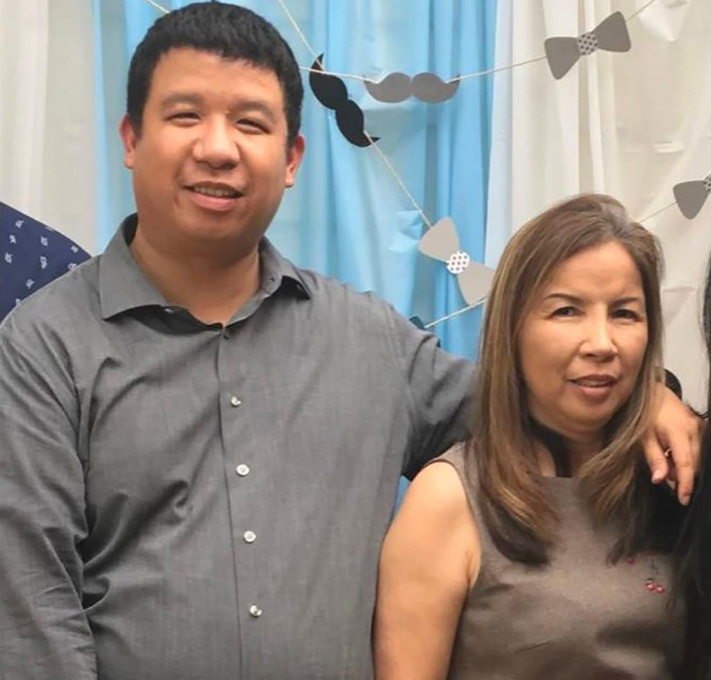 Nguyet Le with her son, Nguyen Le, who worked with her at the Arby’s and discovered her body in the freezer, the family said.