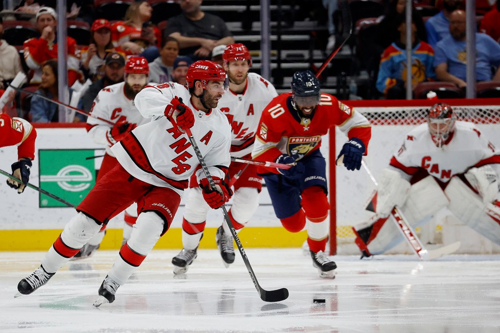 Jordan Martinook #48 of the Carolina Hurricanes skates with the puck against the Florida Panthers