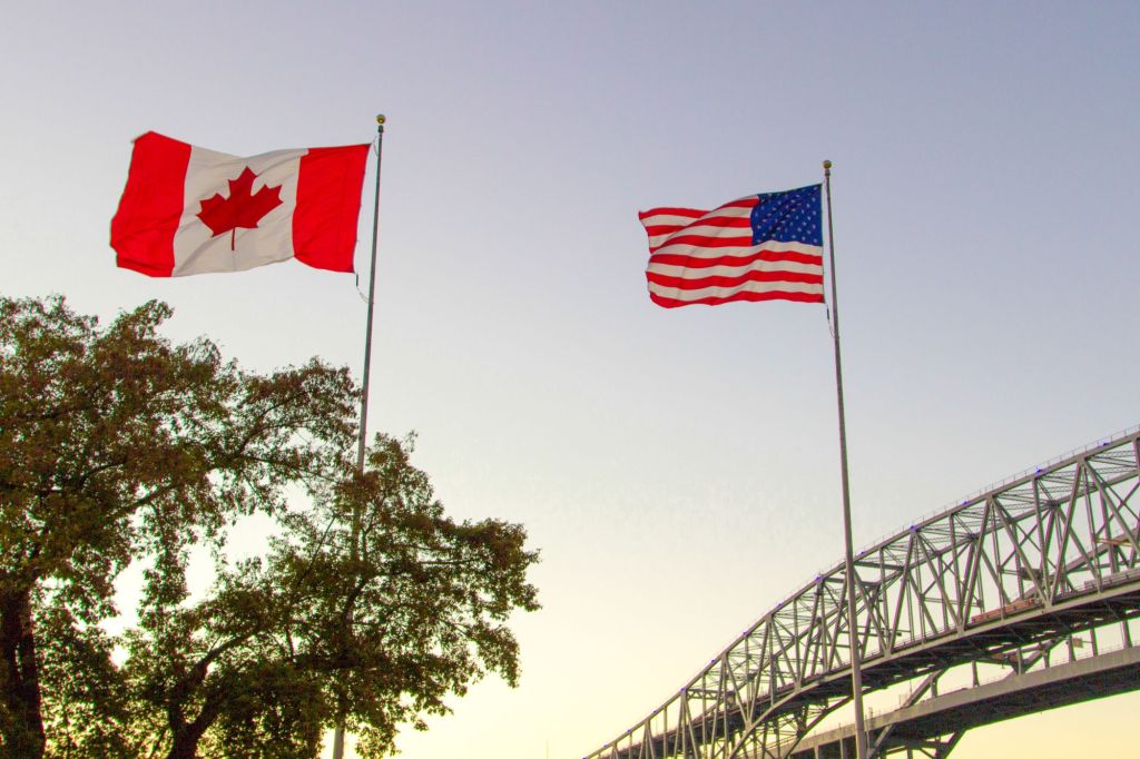 A man with a sign indicating he had explosives in his truck was stopped after attempting to get to the Canadian border near Houlton, Maine.