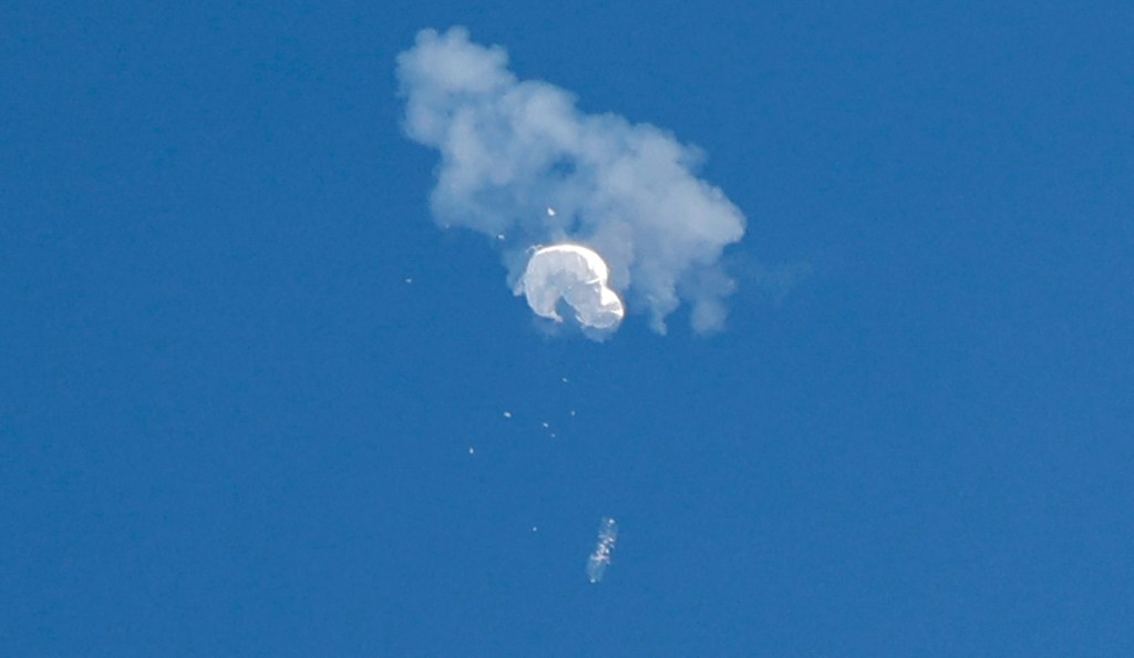 The suspected Chinese spy balloon drifts to the ocean after being shot down off the coast in Surfside Beach, South Carolina, on February 4, 2023.  