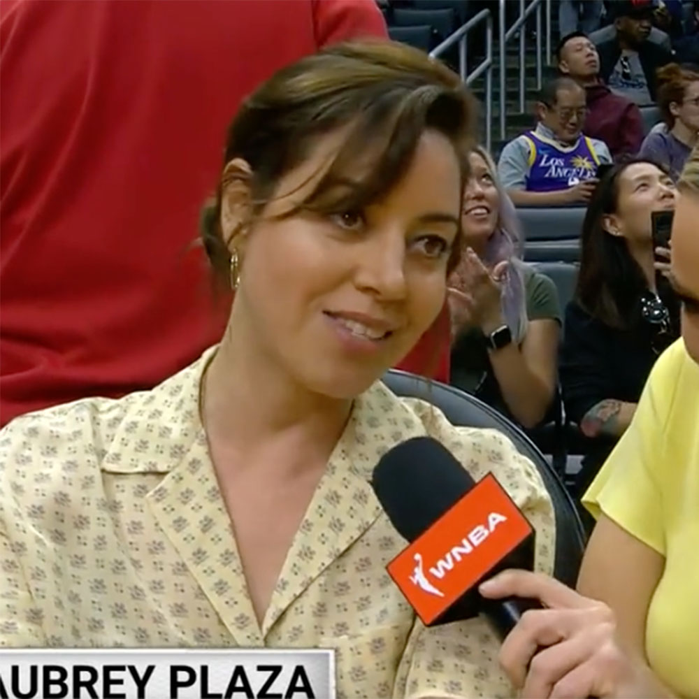 Aubrey Plaza being interviewed at the WNBA game between the Minnesota Lynx and LA Sparks at Crypto.com Arena on June 20, 2023. 