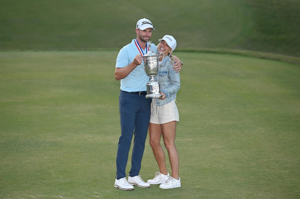 Clark of the United States poses with his wife Julia Kemmling and the trophy after winning the 123rd U.S. Open Championship at The Los Angeles Country Club on June 18, 2023