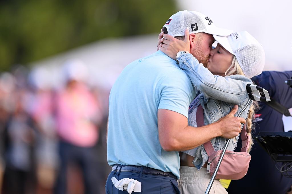 Clark of the United States reacts with his wife Julia Kemmling after his winning putt on the 18th green during the final round of the 123rd U.S. Open Championship at The Los Angeles Country Club