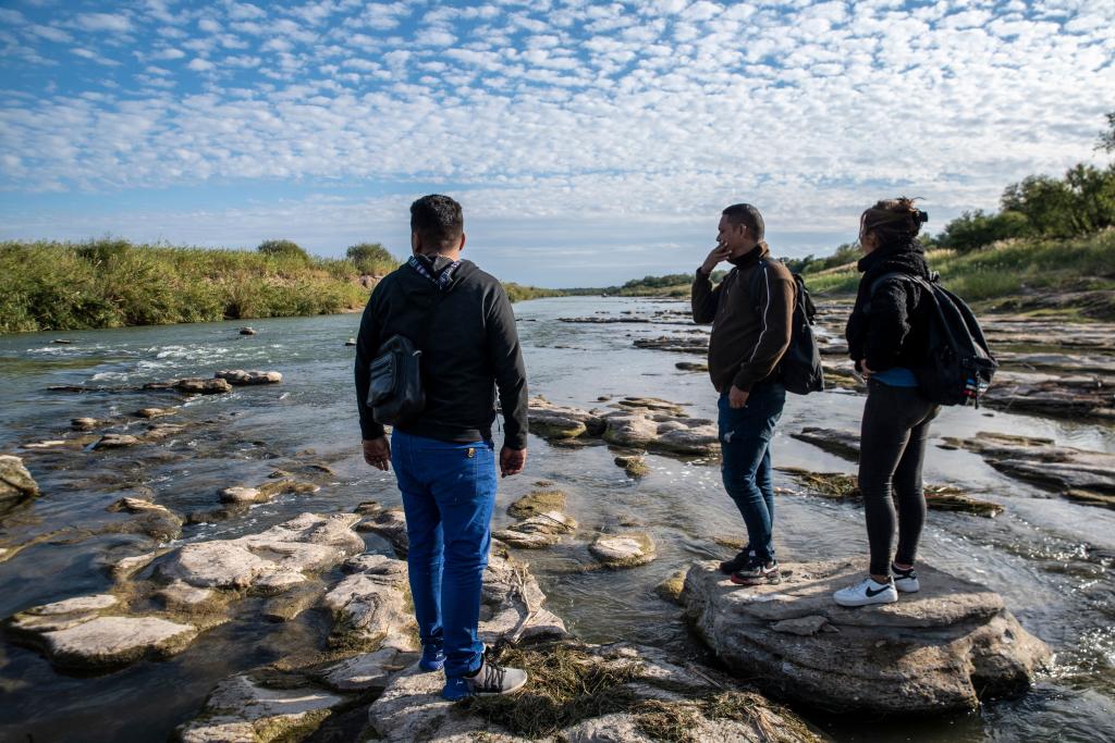 A group of migrants look for a place to cross the Rio Grande in Piedras Negras, Mexico on November, 16, 2022.