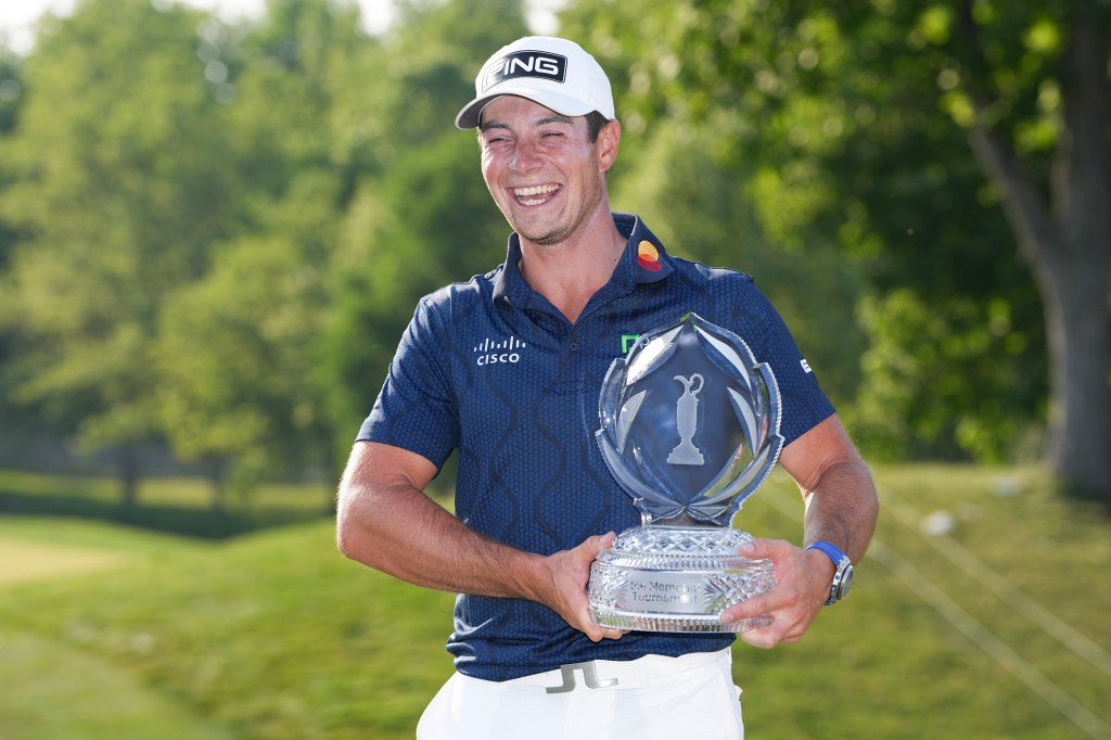 Viktor Hovland of Norway poses with the trophy after winning the Memorial Tournament.