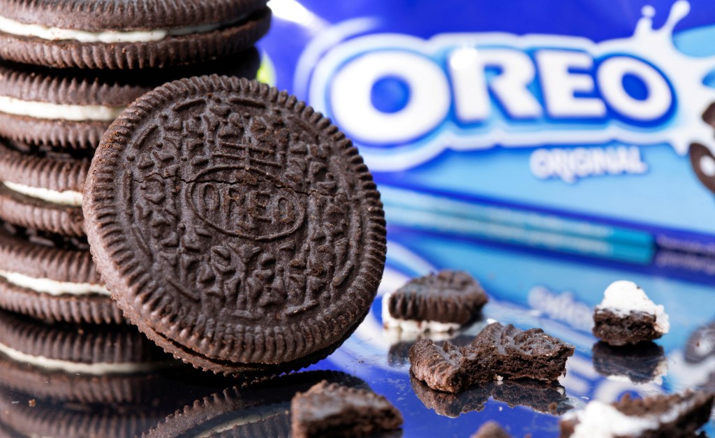 The image featues a stack of Oreo cookies in front of an Oreo box.