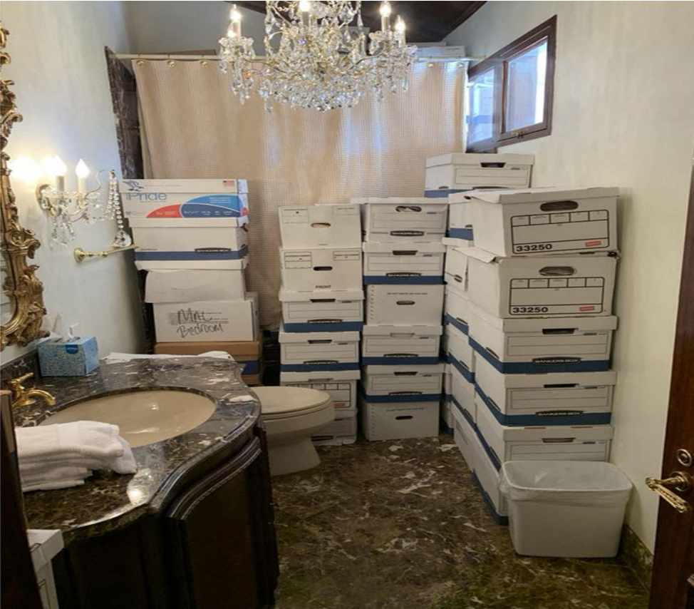 This image showing stacks of boxes in a bathroom was featured attached as evidence in the indictment against former president Donald Trump.