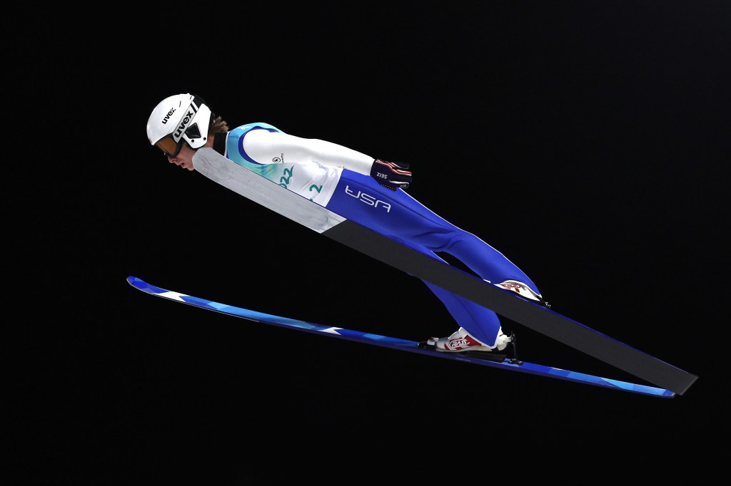 Patrick Gasienica participates in the men's team ski jumping competition in February 2022. 