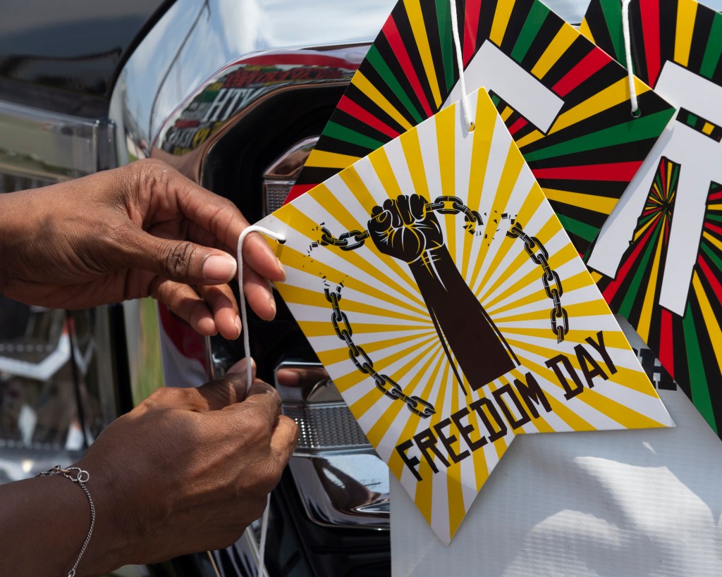 Florence Bell decorates her truck for the annual Galveston Juneteenth Parade in Galveston, Texas.