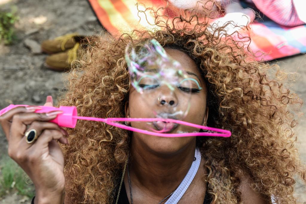 A woman blows bubbles during a Juneteenth celebration in Fort Greene in Brooklyn.