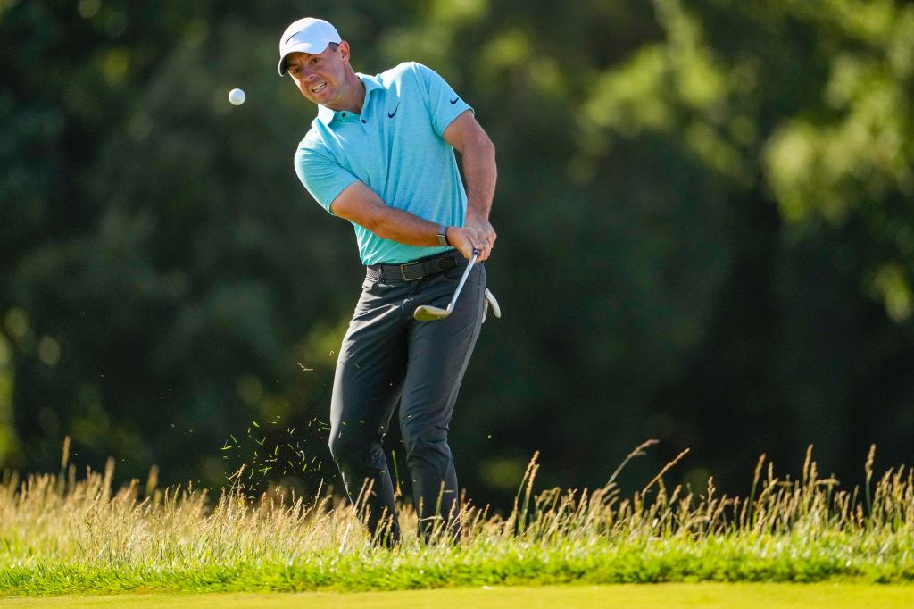 Rory McIlroy chips to the green on the 14th hole during the final round of the U.S. Open golf tournament.