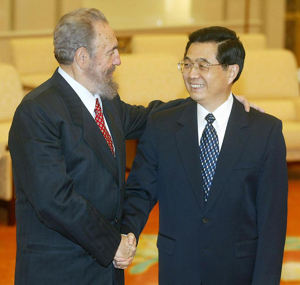 Fidel Castro, (left) pictured with then-Vice President of China Hu Jintao in 2003.