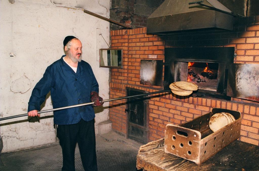 A Jewish baker making traditional hand baked matzah. 