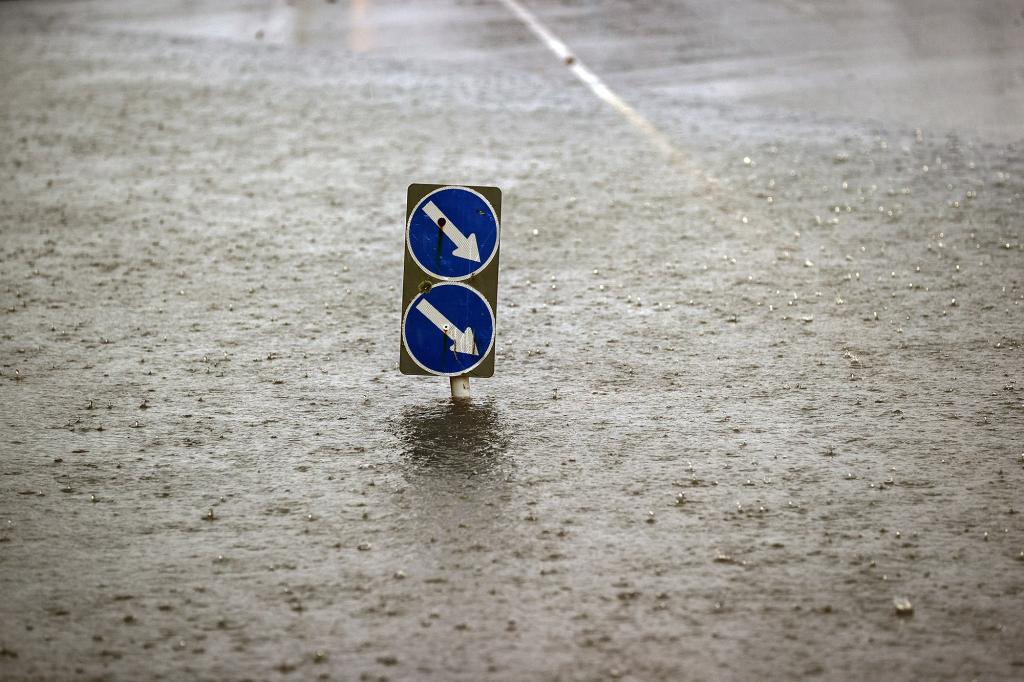 Flood water leaving an isolated road sign on May 09, 2023 in Auckland, New Zealand. 