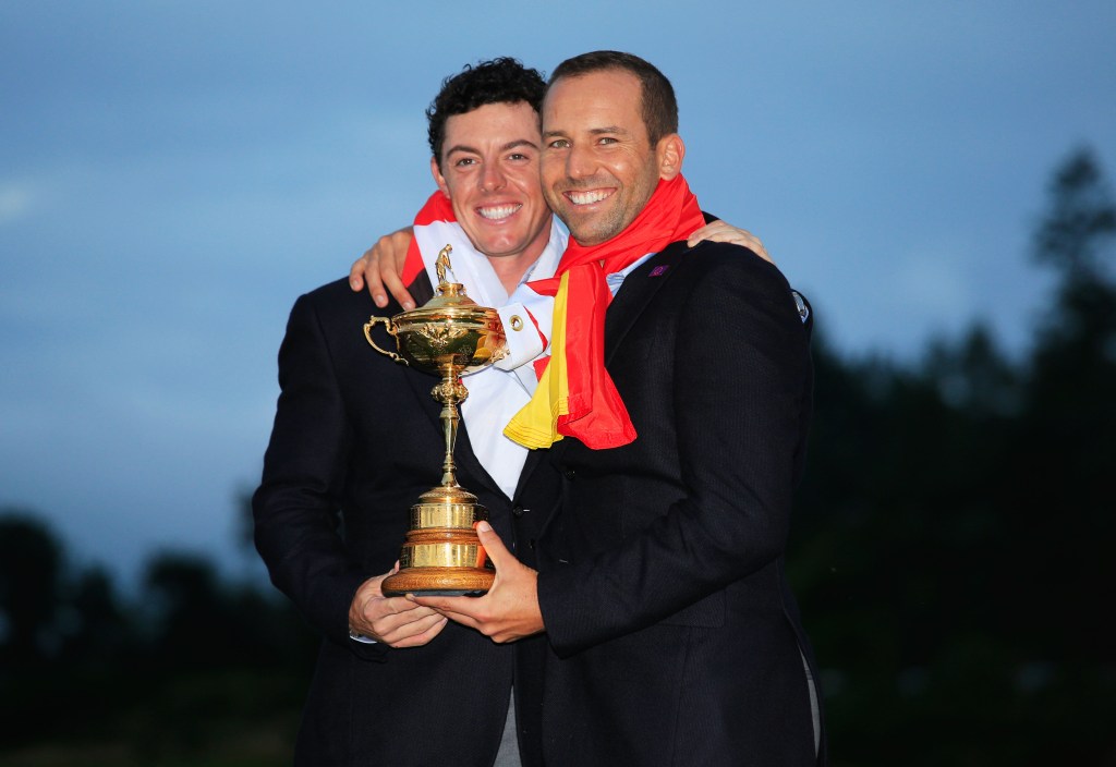 Rory McIlroy and Sergio Garcia pose with the Ryder Cup trophy in 2014