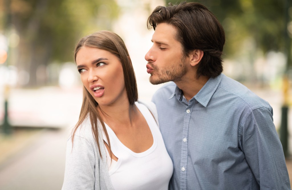 Disgusted,Woman,Rejecting,To,Kiss,Man,Having,Bad,Date,Walking