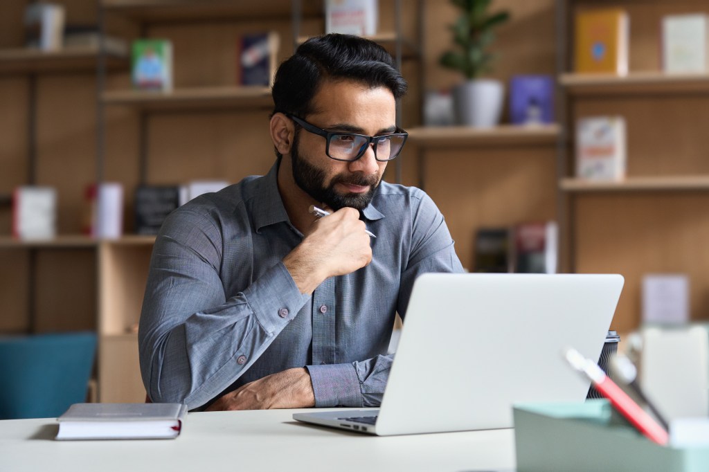 Young professional on computer.