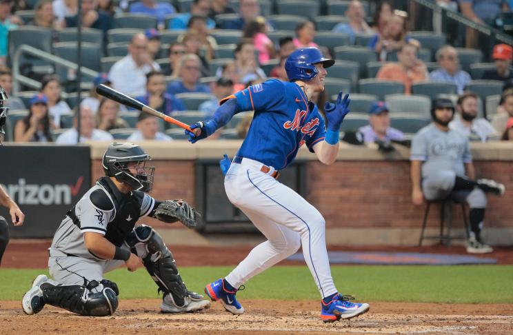 New York Mets third baseman Brett Baty #22 reaches on a fielders choice allowing a run to score during the 4th inning.