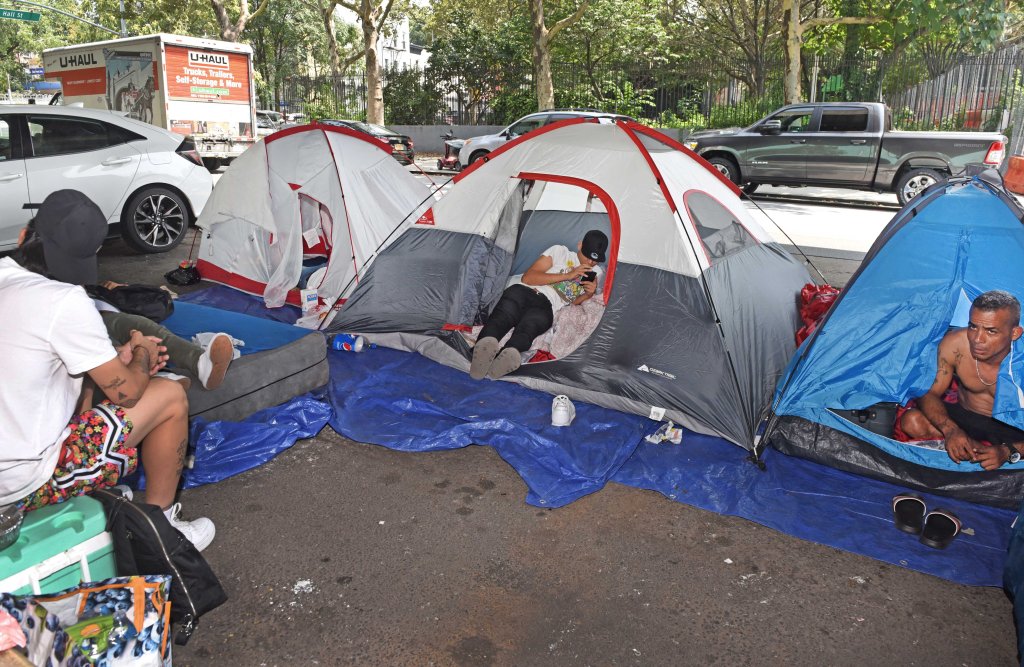 A small group of migrants from Venezuela have set up three camping tents underneath the BQE near the intersection of Hall Street and Park Avenue.