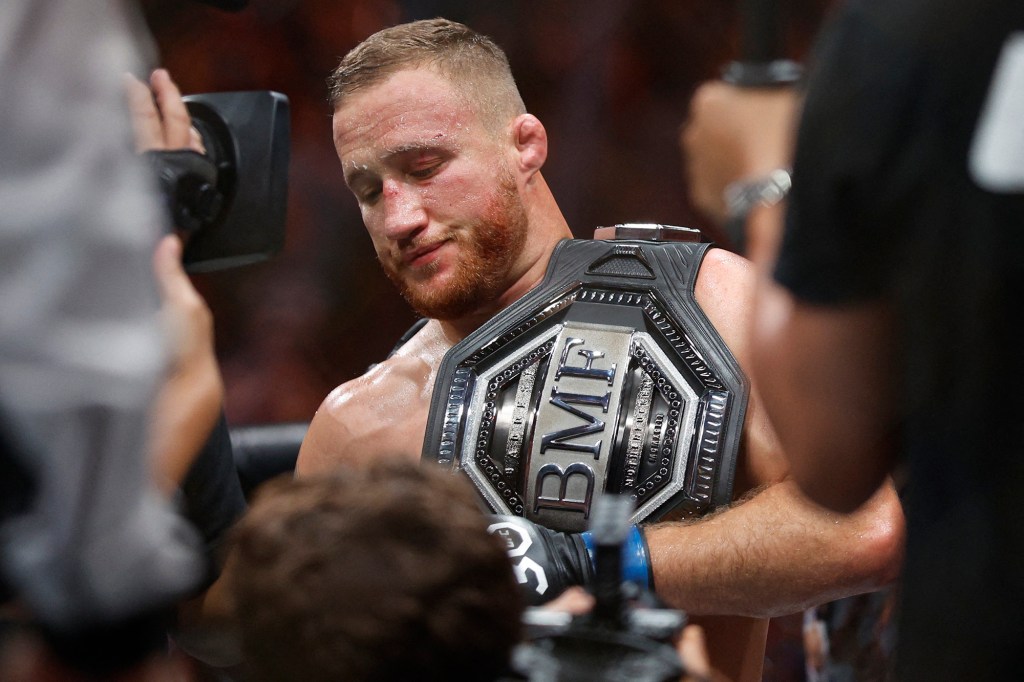 Justin Gaethje holds the UFC BMF belt after winning it in Salt Lake City.