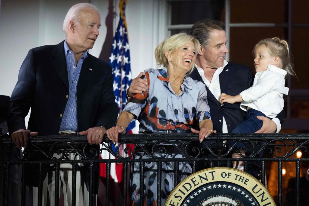 US President Joe Biden, First Lady Jill Biden and Hunter Biden with his son Beau watch the Independence Day fireworks display from the Truman Balcony of the White House.