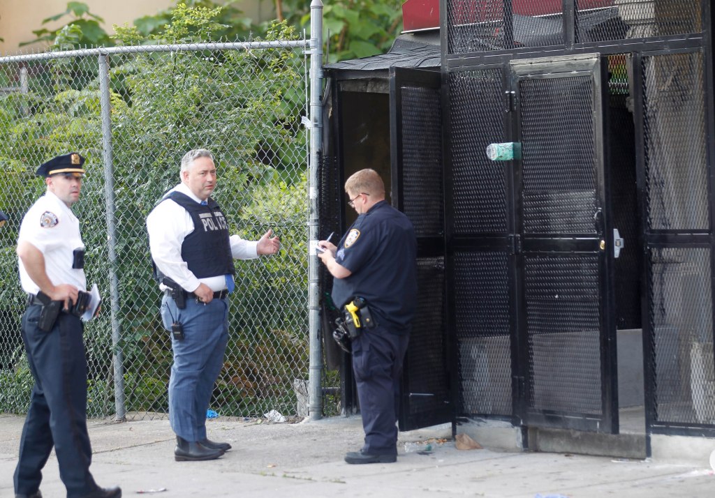 Police investigate the scene of a shooting in the Bronx Monday morning. 