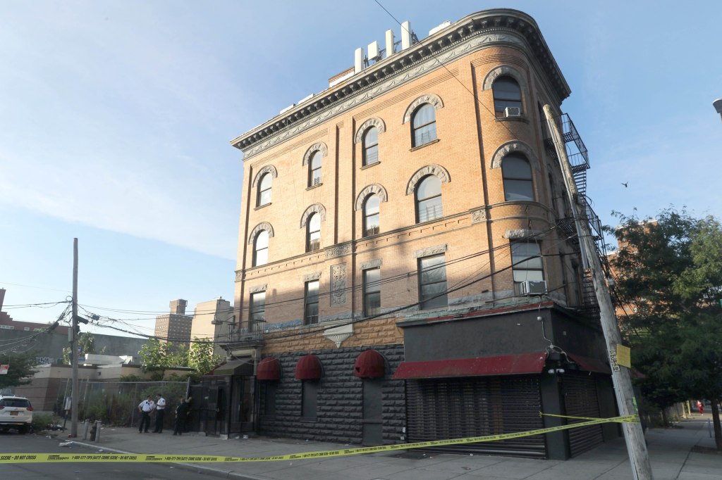 The scene of a shooting, a building behind police tape, in the Bronx Monday morning. 