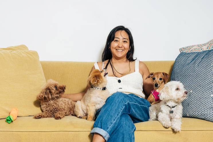 Dog nanny Cynthia Okimoto, photographed with Coco, Marley, Max and Ruby