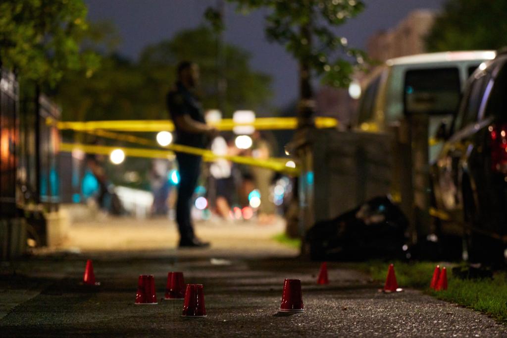 Police investigate the scene of a shooting in the Bronx Monday night. 