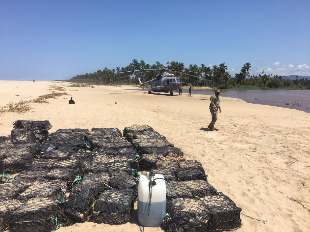 Members of the Mexican Navy stand next to packages 