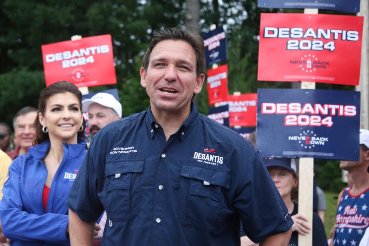 Republican presidential candidate and Florida Gov. Ron DeSantis and his wife Casey, walk in the July 4th parade.